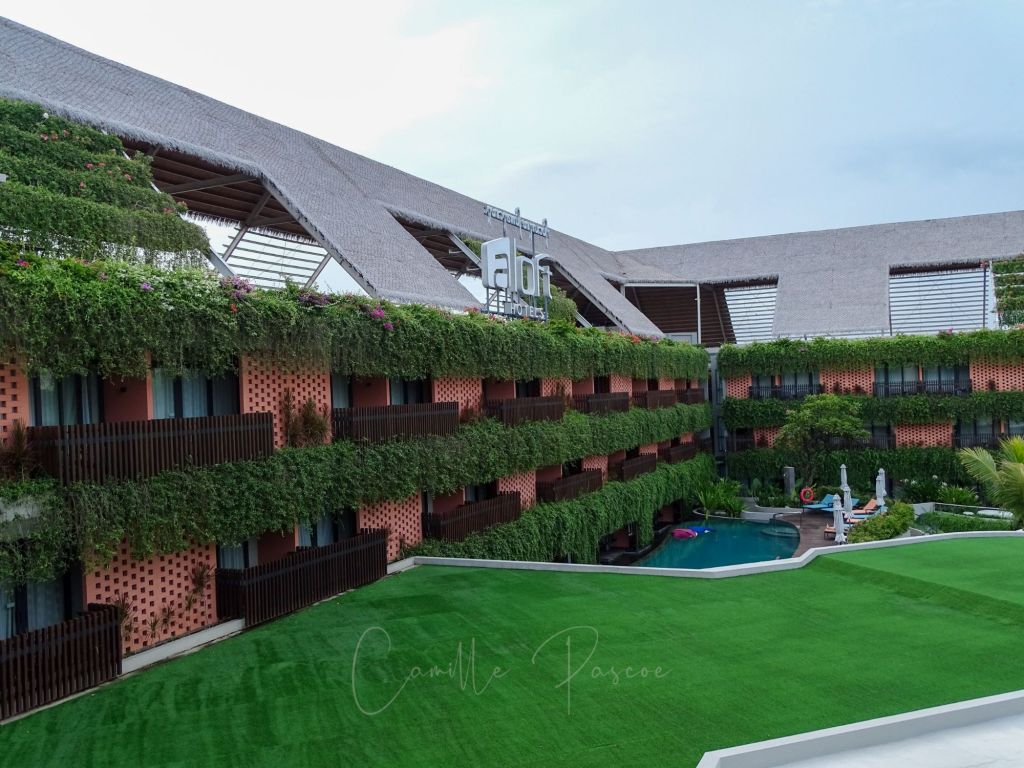 The courtyard and pool at Beachwalk Residence is a beautiful manicured greenspace